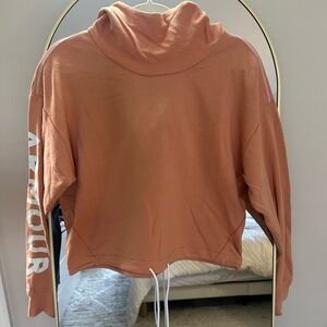 Women’s Under Armour Salmon Color Cropped Hoodie with White Logo on Sleeve